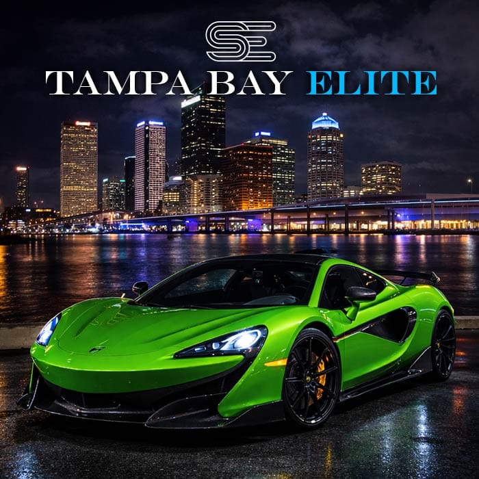 Green sports car parked by a waterfront at night with a city skyline in the background, text reads "Tampa Bay Elite" above.